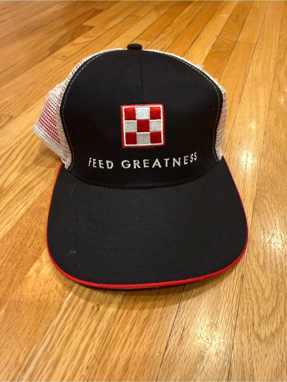 Feed Greatness Black & White Trucker Cap